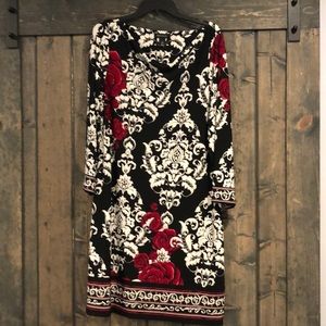 Black, red and white long sleeved dress.